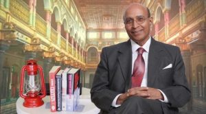 Paresh Modi seated in a fancy library atrium